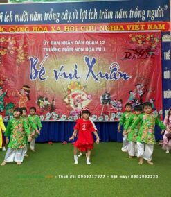 Áo dài xanh lá bé trai